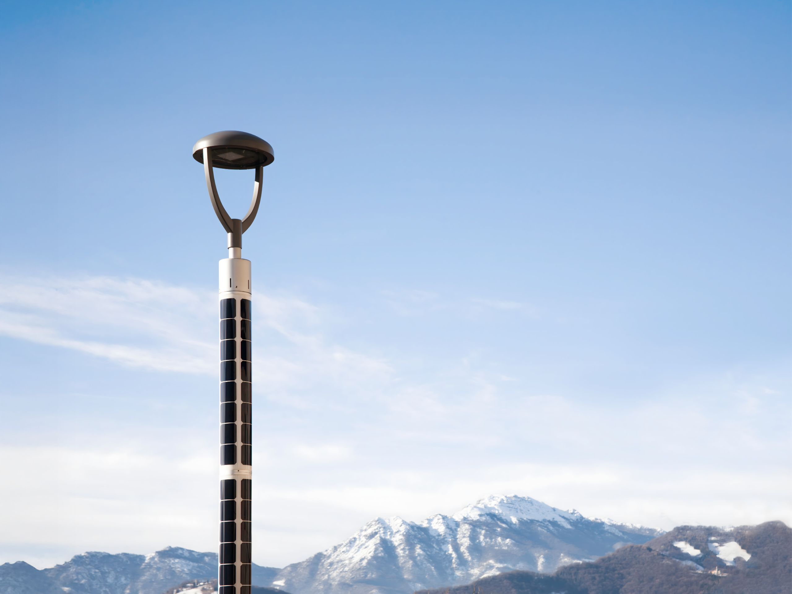 Solar streetlight with mountain scenery in Valbrembilla, Italy.